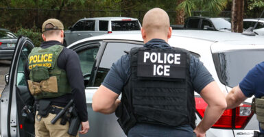ICE officers, with assistance from Homeland Security Investigations and Border Patrol, perform enforcement operations in Delray Beach, Florida, on Jan. 23.