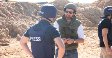 Eylon Levy, then-Israeli government spokesman, speaks with journalists near a tunnel in northern Gaza.
