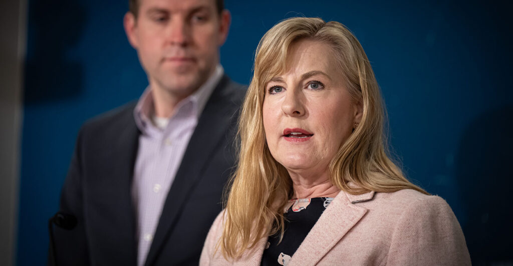Melissa Hortman in a blouse and tan suit coat