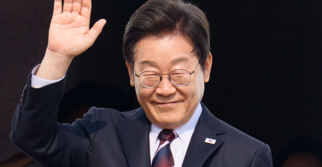 South Korea's President Lee Jae-myung waves as he board his plane at Seoul Air Base in Seongnam on June 16, 2025, before departing for Canada to attend the G7 summit.