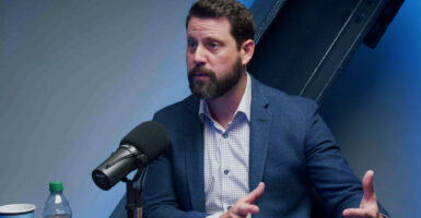 Babylon Bee CEO Seth Dillon speaking into microphone