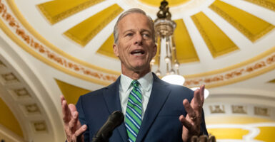 Senate Majority Leader John Thune, R-S.D., with the inside of the Capitol Dome overhead.