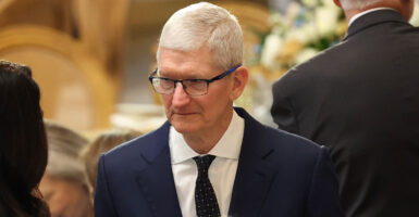Apple CEO Tim Cook in a dark suit and tie