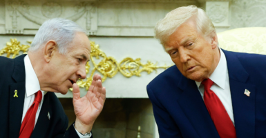 Israeli Prime Minister Benjamin (L) talks to U.S. President Donald Trump during a meeting in the Oval Office of the White House on April 7, 2025 in Washington, D.C. (Kevin Dietsch/Getty Images)