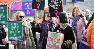 Women protest men in women's prisons