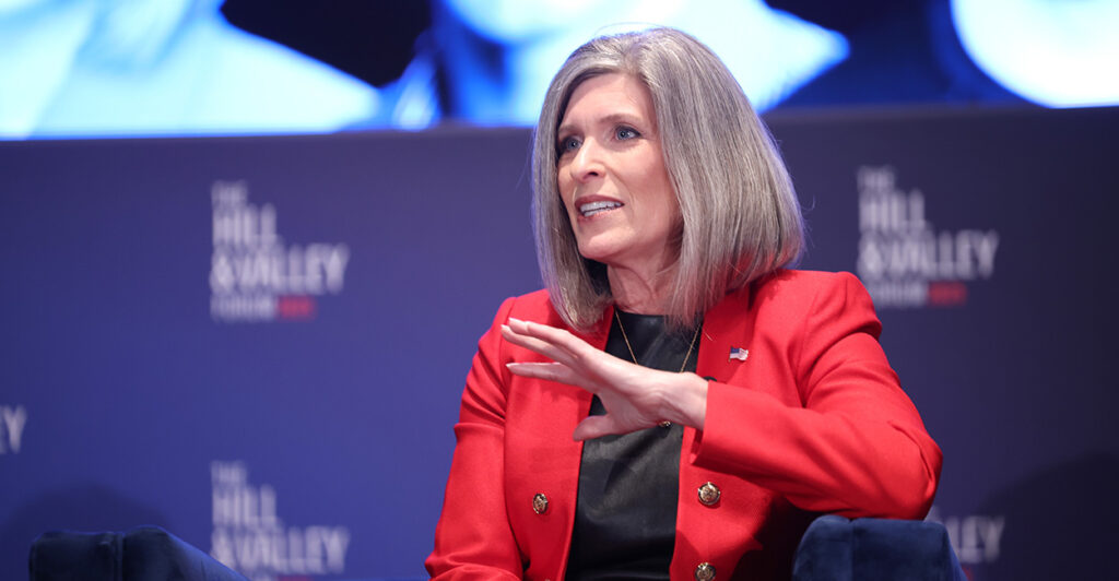Sen. Joni Ernst, R-Iowa, in a red blazer