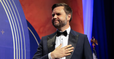 Vice President JD Vance in a tuxedo with his right hand on his chest