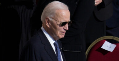 Joe Biden walks with sunglasses on at the Pope's funeral at the Vatican in Rome.