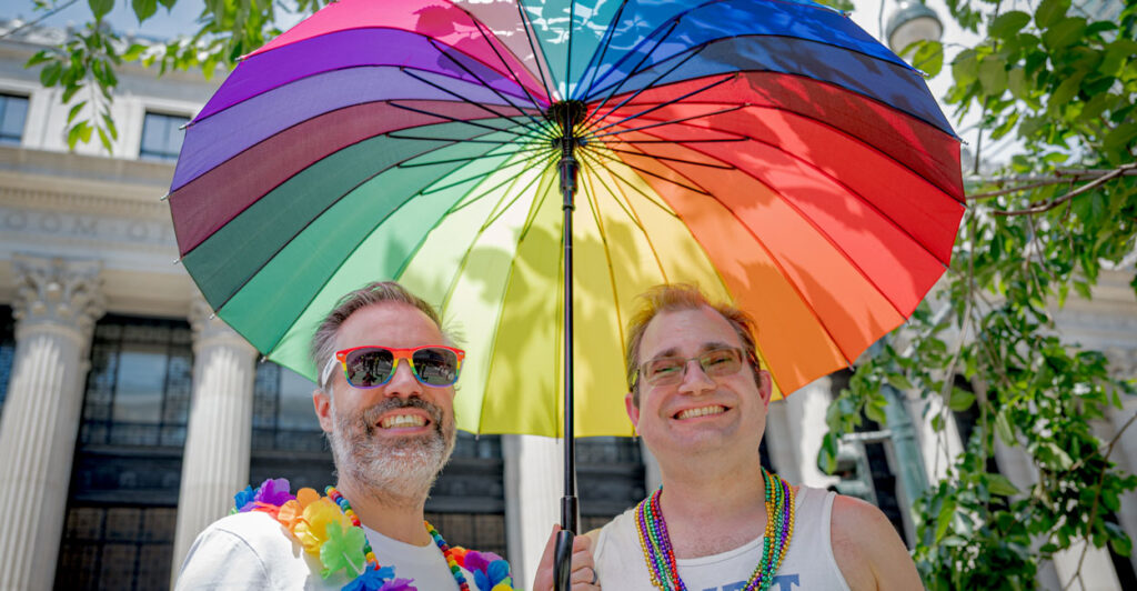 Two homosexual men sport a rainbow umbrella at a Queer Liberation March in Manhattan, New York City, on June 29.