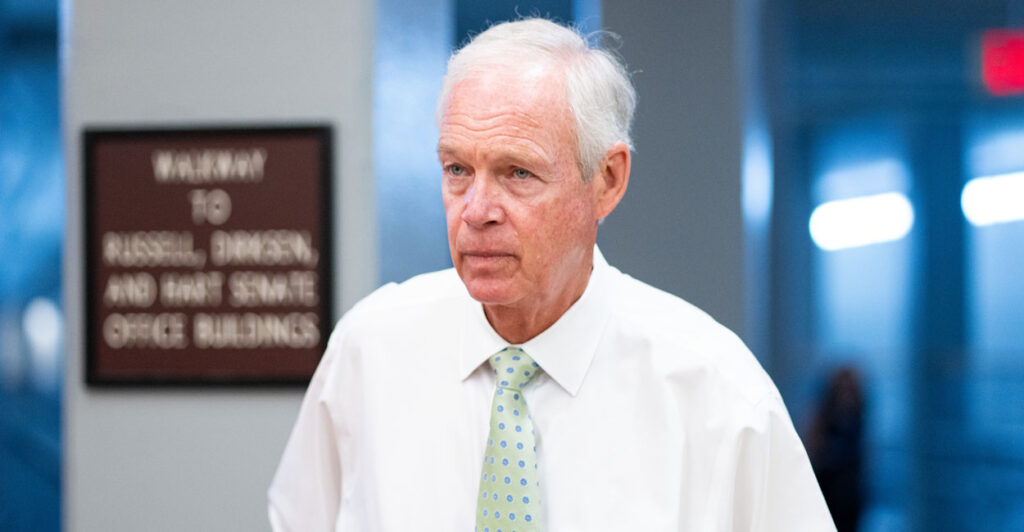 Sen. Ron Johnson, R-Wis., arrives for a vote at the Capitol on Wednesday in a white shirt and green tie, but not a sport coat. (Bill Clark/CQ-Roll Call via Getty Images)