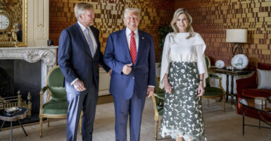 President Donald Trump gives a thumbs up, while flanked by King Willem-Alexander of the Netherlands and Queen Maxima at Paleis Huis ten Bosch in The Hague.