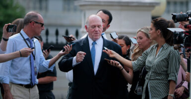 White House border czar Tom Homan talks with reporters near the White House on Monday.
