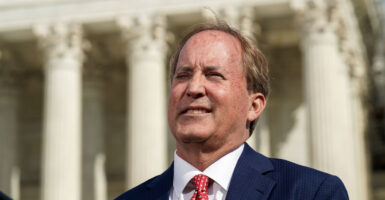 Close-up of Texas Attorney General Ken Paxton standing in front of the Supreme Court.