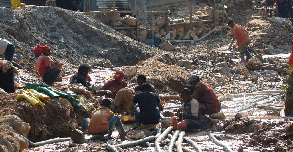 A group of children and others working a cobalt mine in the Democratic Republic of Congo.