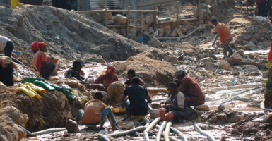 A group of children and others working a cobalt mine in the Democratic Republic of Congo.