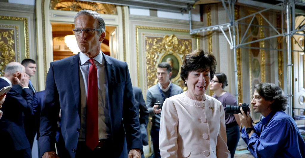 Sen. John Thune and Sen. Susan Collins walk together amid a crowd of people in the U.S. Capitol.