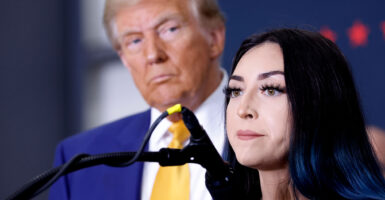 Donald Trump listens as Alexis Nungaray speaks about her slain preteen daughter, Jocelyn, on Oct. 25 in Austin, Texas.