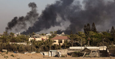 Smoke is seen rising from rising from Deir al-Balah, Gaza, on Monday.
