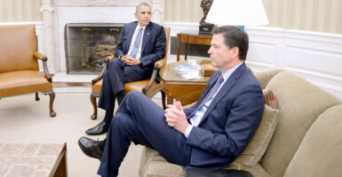 Barack Obama and James Comey sit in the Oval Office.
