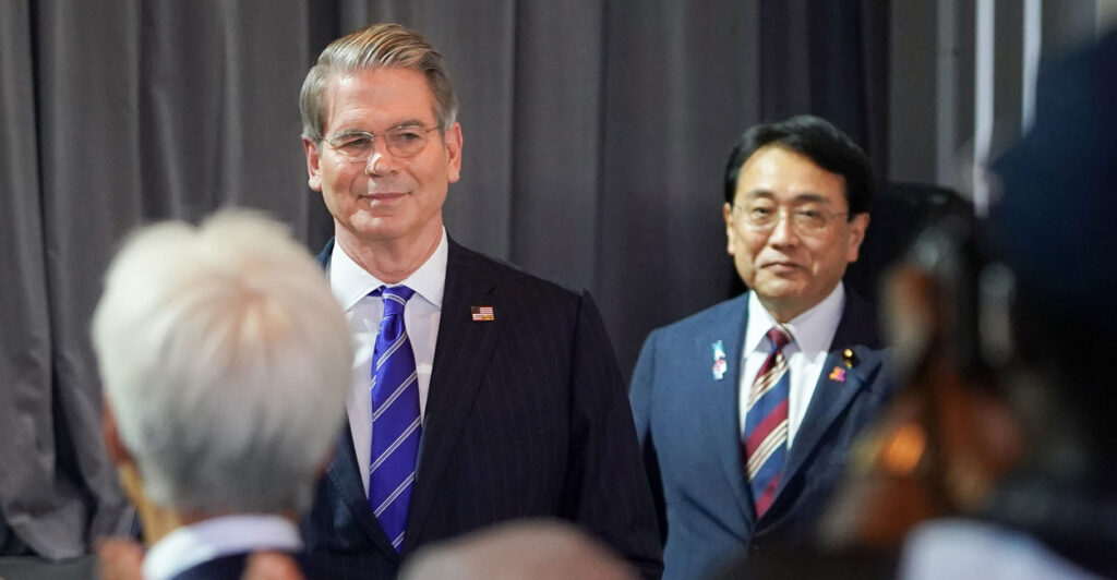 Treasury Secretary Scott Bessett walks with Japan's minister in charge of Economic Revitalization Ryosei Akazawa.