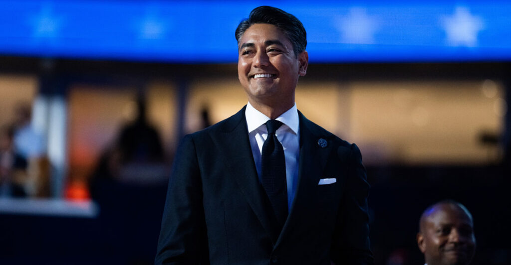 Smiling Cincinatti Mayor Aftab Pureval in a dark suit.