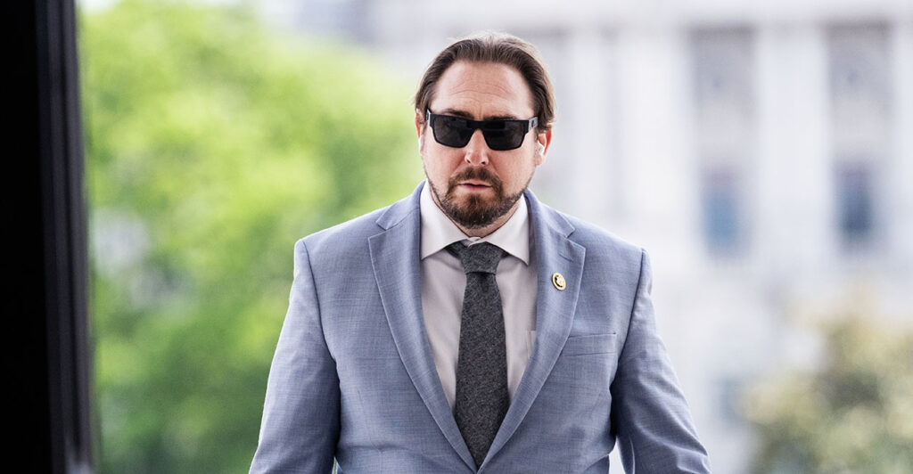 Eli Crane in a blue suit