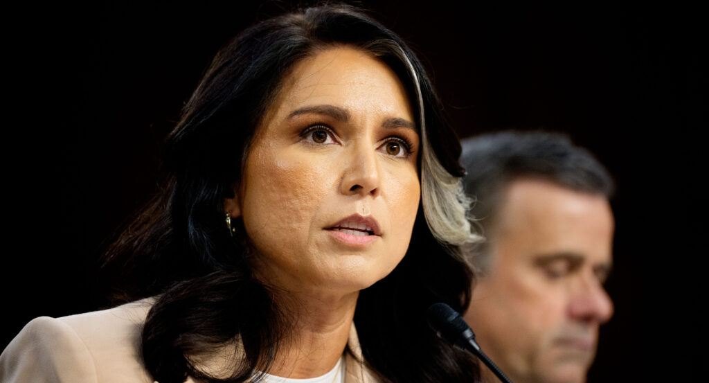 Tulsi Gabbard is looking straight ahead during a hearing.