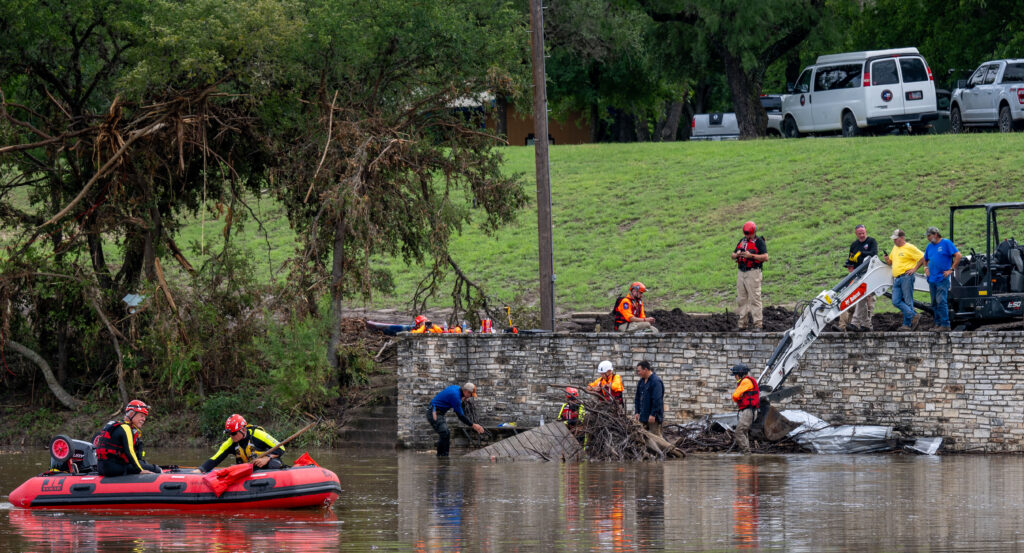 Rescuers are working on land and on water to remove debris and look for survivors.