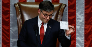 Speaker of the House Mike Johnson, R-La., displays the vote tally for the final passage of the "big, beautiful bill."