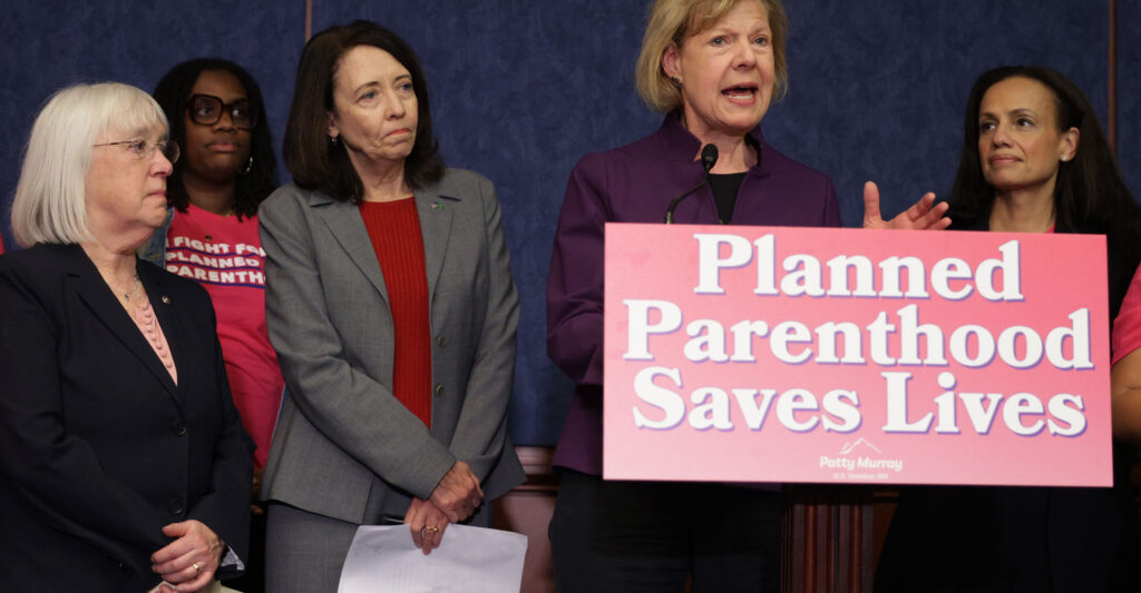 U.S. Sen. Tammy Baldwin (D-WI) speaks as (L-R) Sen. Patty Murray (D-WA), Sen. Maria Cantwell (D-WA) and President of Planned Parenthood Alexis McGill Johnson listen during a news conference on the budget reconciliation bill at the U.S. Capitol on May 14, 2025 in Washington, DC.