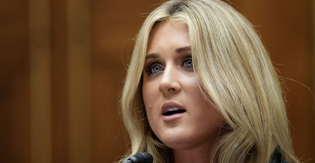 Riley Gaines with a nondescript background