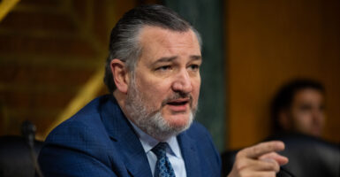 Sen. Ted Cruz, R-Texas, points a finger at a witness at a Senate committee hearing.