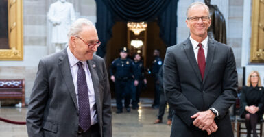 Senate Minority Leader Chuck Schumer, D-N.Y. (left), and Senate Majority Leader John Thune, R-S.D., in the Capitol Rotunda