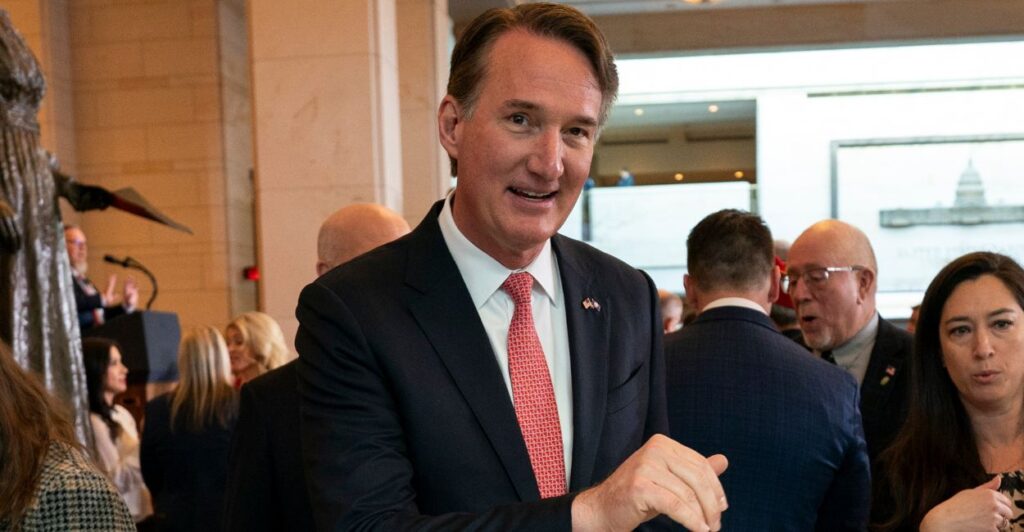 Glenn Youngkin standing among a crowd.