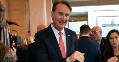 Glenn Youngkin standing among a crowd.