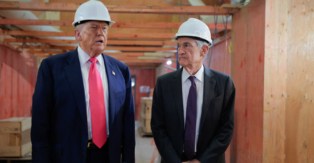 With both sporting hard hats, President Donald Trump (left) tours the Federal Reserve construction with Fed Chairman Jerome Powell.