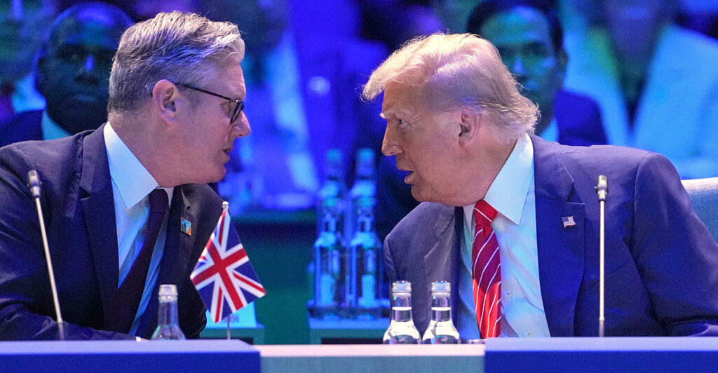 President Donald Trump and UK Prime Minister lean in to talk at the 2025 NATO Summit.