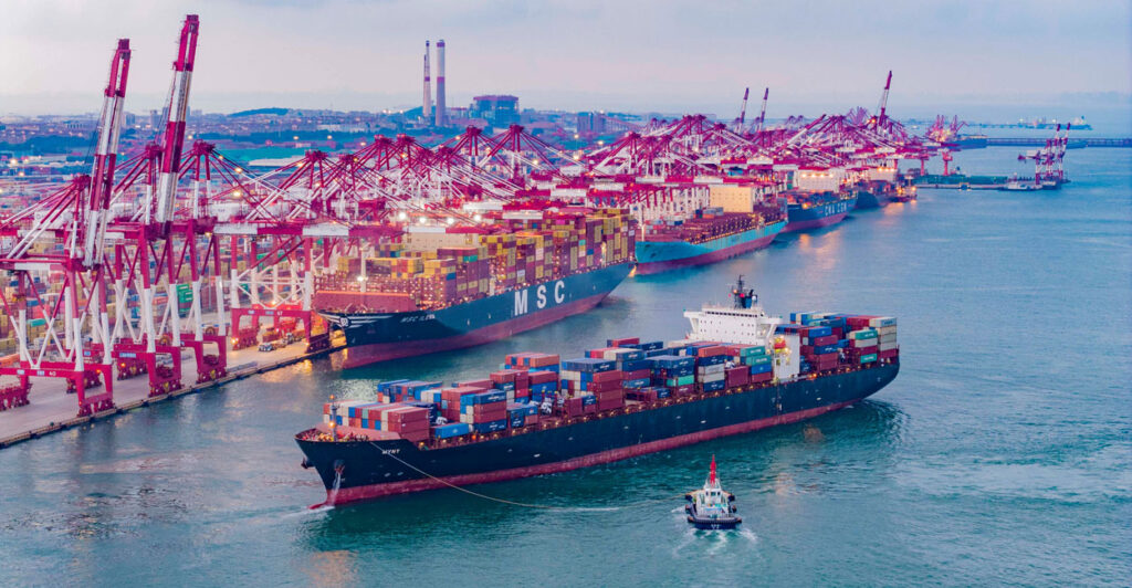 A cargo ship heads for the Qianwan container terminal of Qingdao Port in Qingdao City, Shandong Province, China, on July 28.