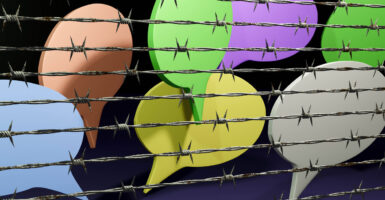 A graphic featuring colorful quote bubbles behind a barbed wire fence, symbolizing censorship.