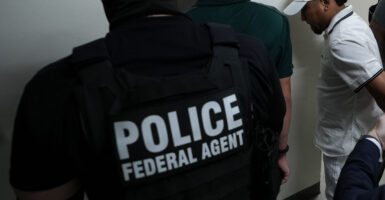 ICE officers apprehend dozens of illegal aliens inside the Federal Plaza courthouse in New York City on June 26.