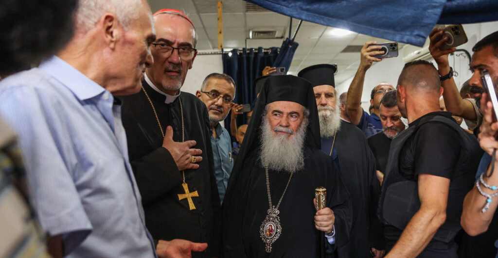 Greek Orthodox Patriarch of Jerusalem Theophilos III (C), Latin Patriarch of Jerusalem Pierbattista Pizzaballa (CL), Metropolitan Isychios of Capitolias (CR), visit the Arab Ahli (Baptist) Hospital in Gaza City on July 18, 2025.