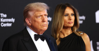 President Donald Trump and first lady Melania Trump arrive to attend "Les Miserables" at the Kennedy Center on June 11.