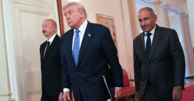 President Donald Trump arrives at a peace pact signing ceremony with Azerbaijani President Ilham Aliyev (left) and Armenian Prime Minister Nikol Pashinyan at the White House on Aug. 8.