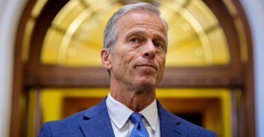 Senate Majority Leader John Thune, R-S.D., speaks to reporters off the Senate floor on July 1.