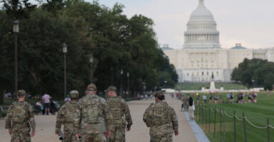 Members of the National Guard walk on the National Mall on August 14, 2025.