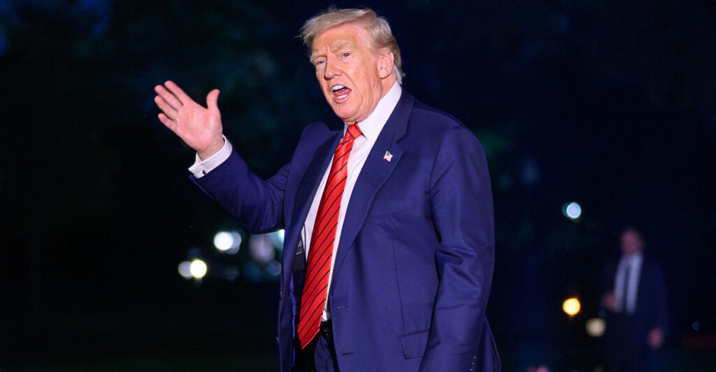 President Donald Trump waves