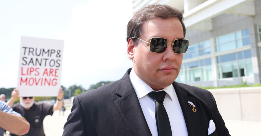 George Santos walks into court in formal attire as protestors accost him.