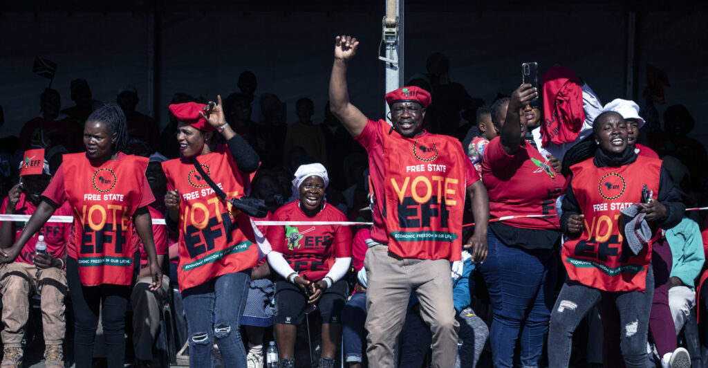 Economic Freedom Fighter supporters sing and dance when Marxist party leader Julius Malema sings "Kill the Boer, kill the farmer" at a campaign appearance on May 25 in Koppies, South Africa.