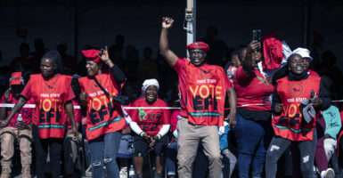 Economic Freedom Fighter supporters sing and dance when Marxist party leader Julius Malema sings "Kill the Boer, kill the farmer" at a campaign appearance on May 25 in Koppies, South Africa.