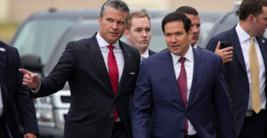 Marcio Rubio walks along with Pete Hegseth.
